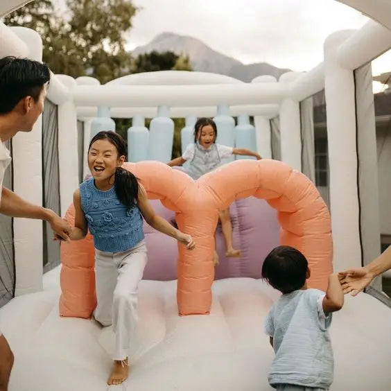 Pastel Inflatable Bounce House with Obstacles