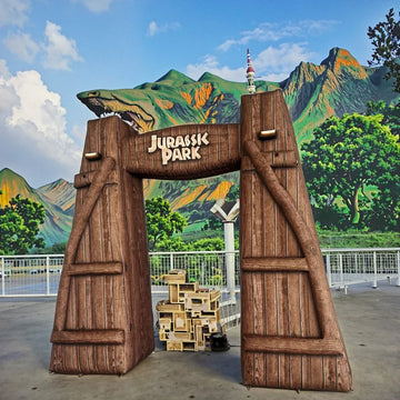 Arco inflable con diseño de dinosaurio para promociones al aire libre