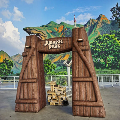 Arco inflable con diseño de dinosaurio para promociones al aire libre