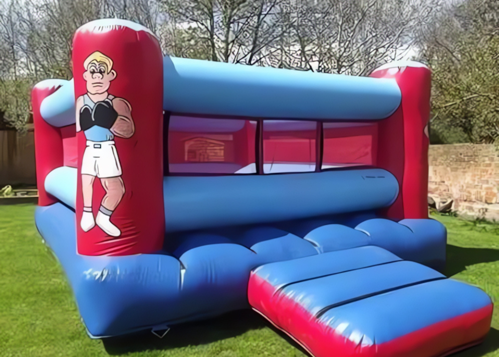 Riesige aufblasbare Boxhandschuhe und Ring